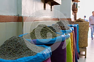 Seeds and spices in canvas bags at the traditional souk market in the medina or old town of Marrakech, Morocco