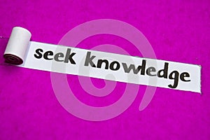 Seek Knowledge text, Inspiration, Motivation and business concept on purple torn paper