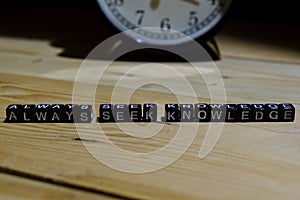 Always seek knowledge written on wooden blocks. Education and business concept