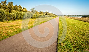 Seemingly endless country road in a Dutch polder