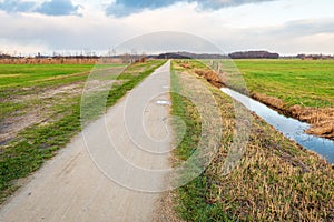 Seemingly endless straight path in a rural landscape