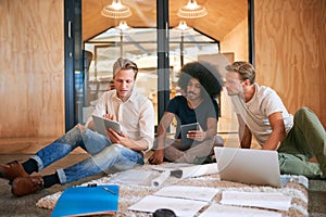 This seems like a trend we can capitalise on...a team of designers brainstorming on the floor in an office.