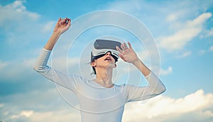 It seems so real. Cute girl play in simulated environment. Young woman gesturing in vr glasses. Pretty girl wear virtual