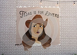 Picture of a cowgirl on an outside wall in the Bishop Arts District in Oak Cliff in Dallas, Texas. photo