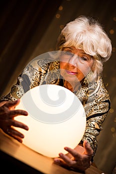 Seer holding crystal ball photo