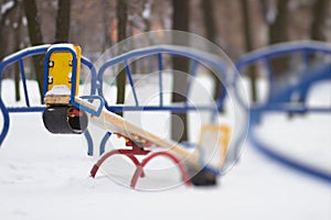Seesaw playground in snow