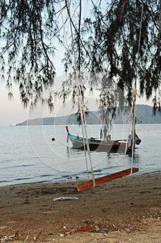 Seesaw on tropic beach