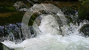 Seething picturesque clean mountain river in slow motion. The strength and beauty of a mountain stream