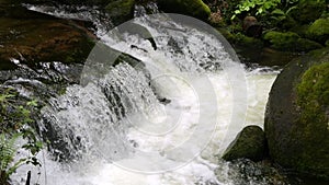 Seething picturesque clean mountain river in slow motion. The strength and beauty of a mountain stream