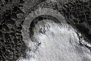 Seeweed and sea algae drying out in abstract patterns on the black basalt lava coast of Ponta do MistÃÂ©rio on ilha Terceira Island photo