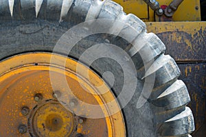 Segment of large tire on road grader