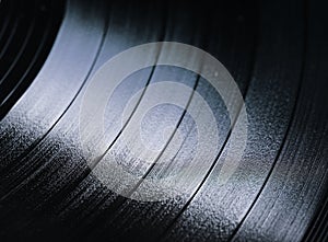 Segment of vinyl record with label showing the texture of the gr