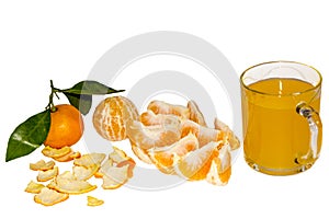 Segments of an orange and a juice glass