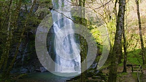 Seimeira de Vilagocende Waterfall Plunging Into Natural Pool In Forest