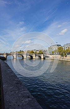 The Seine in Paris with a bridge on a clear sunny day