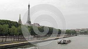 The Seine Rive with The Eiffel Tower in the background in Paris, France