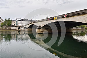 Seine River with Bridge and Traditional Parisian Apartment Buildings in Paris, France