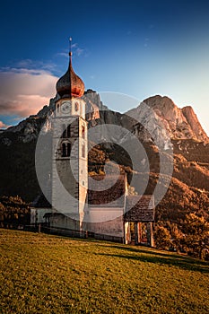 Seis am Schlern, Italy - St. Valentin Church and famous Mount Sciliar in the Italian Dolomites with blue sky photo