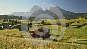 Seiser Alm Alpe di Siusi with Langkofel mountain at sunrise, Italy