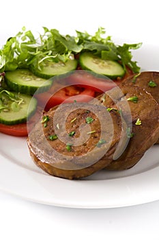 Seitan with vegetables isolated on white background. Fake meat.