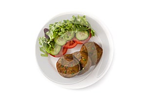 Seitan with vegetables on isolated on white background. Fake meat.