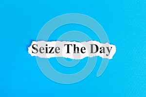 Seize The Day text on paper. Word Seize The Day on torn paper. Concept Image