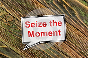 Seize the moment. Text inscription in the banner plate.