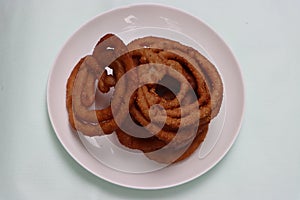 Sel roti is a Nepali traditional homemade, sweet, ring-shaped rice bread doughnut