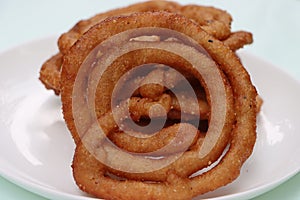 Sel roti is a Nepali traditional homemade, sweet, ring-shaped rice bread doughnut