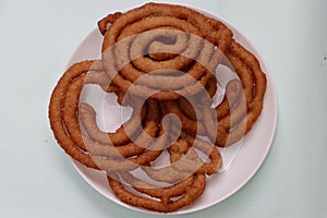 Sel roti is a Nepali traditional homemade, sweet, ring-shaped rice bread doughnut