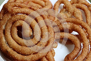 Sel roti is a Nepali traditional homemade, sweet, ring-shaped rice bread doughnut