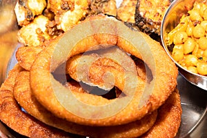 Sel Roti is a traditional Nepalese ring-shaped sweet fried dough made from rice flour