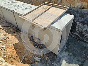 Underground precast concrete box culvert drain under construction at the construction site.
