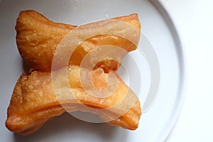 In selcetive focus a piece of deep-fried dough stick  Known as Platongko in Thai language
