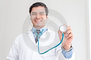 Selected focus on doctor`s hand holding a stethoscope.  Health care concept