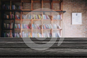 Selected focus empty black wooden table and Library or Bookstor