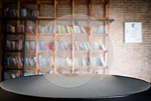 Selected focus empty black wooden table and Library or Bookstor