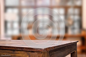 Selected focus empty brown wooden table and Coffee shop blur background with bokeh image, for product display montage.