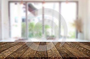 Selected focus empty brown wooden table and Coffee shop blur background with bokeh image. for your photomontage or product display