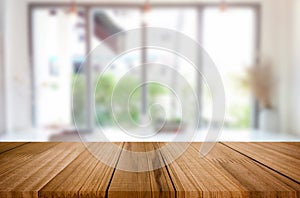 Selected focus empty brown wooden table and Coffee shop blur background with bokeh image. for your photomontage or product display