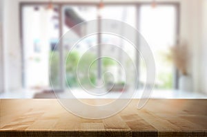 Selected focus empty brown wooden table and Coffee shop blur background with bokeh image. for your photomontage or product display