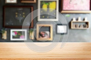 Selected focus empty brown wooden table and Coffee shop or restaurant blur background with bokeh image. for your photomontage or