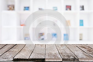 Selected focus empty old wooden table and Library or Bookstore