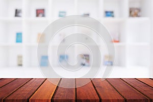 Selected focus empty old wooden table and Library or Bookstore