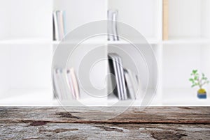 Selected focus empty old wooden table and Library or Bookstore