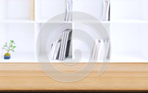 Selected focus empty old wooden table and .Library or Bookstore blur background with bokeh image. for your photomontage or product