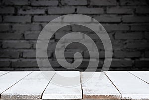 Selected focus empty wooden table and wall texture or old brick