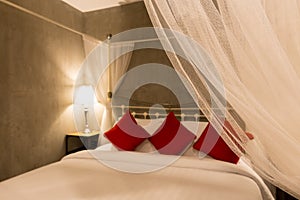 Selected focus mosquito net on four-poster bed