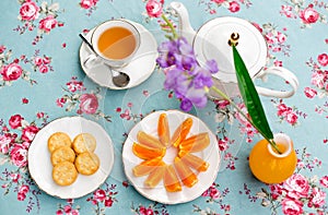 Selected focus tea cup top view English tea with orange fruit an