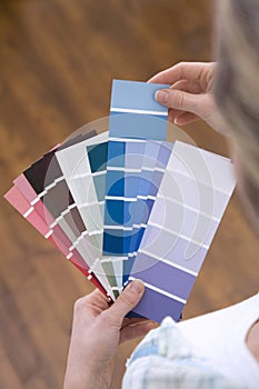 Selecting paint colour for new home. Conceptual image